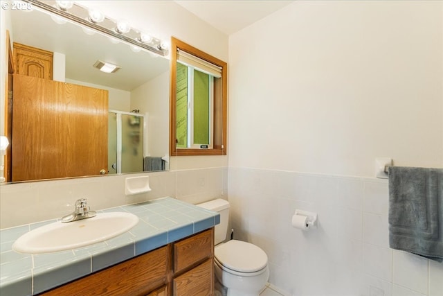 129 Cedar Falls Dr, Kelso, WA 98626 - full bathroom featuring vanity, a shower stall, and toilet
