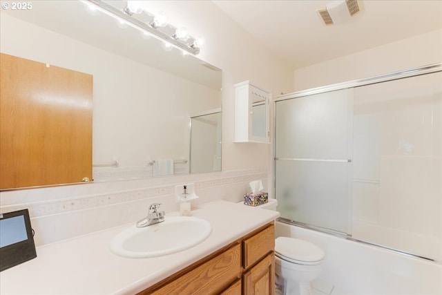 129 Cedar Falls Dr, Kelso, WA 98626 - full bath with shower / bath combination with glass door, visible vents, toilet, and vanity