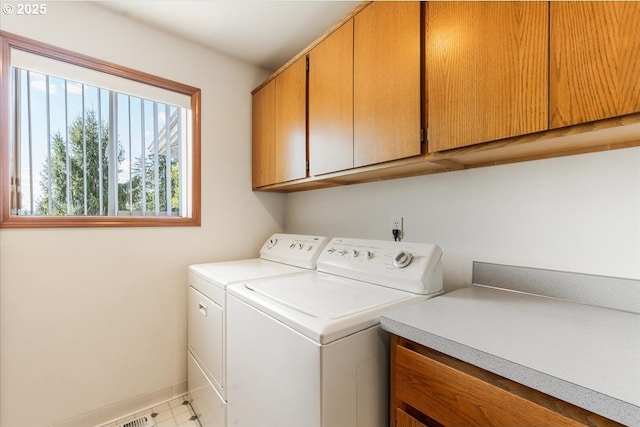 129 Cedar Falls Dr, Kelso, WA 98626 - washroom featuring baseboards, cabinet space, and washer and clothes dryer