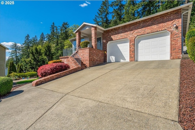 129 Cedar Falls Dr, Kelso, WA 98626 - exterior space with brick siding, an attached garage, stairs, and driveway