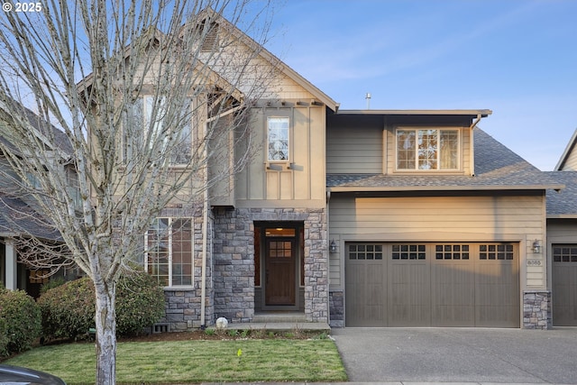 view of front of home featuring a garage and a front lawn