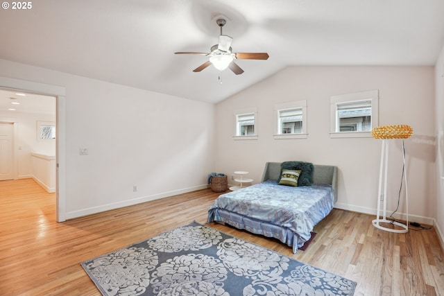 bedroom with lofted ceiling, light hardwood / wood-style flooring, and ceiling fan