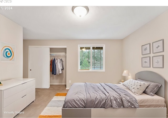 29650 SW Courtside Dr Unit 18, Wilsonville, OR 97070 - bedroom featuring a closet and light carpet