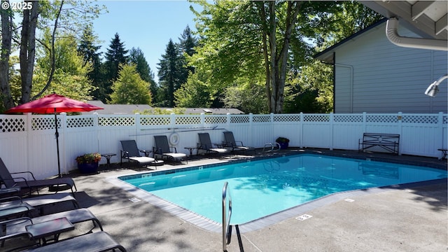 29650 SW Courtside Dr Unit 18, Wilsonville, OR 97070 - view of swimming pool featuring a patio and view of scattered trees