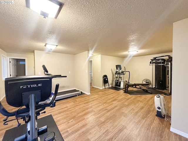29650 SW Courtside Dr Unit 18, Wilsonville, OR 97070 - exercise room with wood finished floors, baseboards, and a textured ceiling