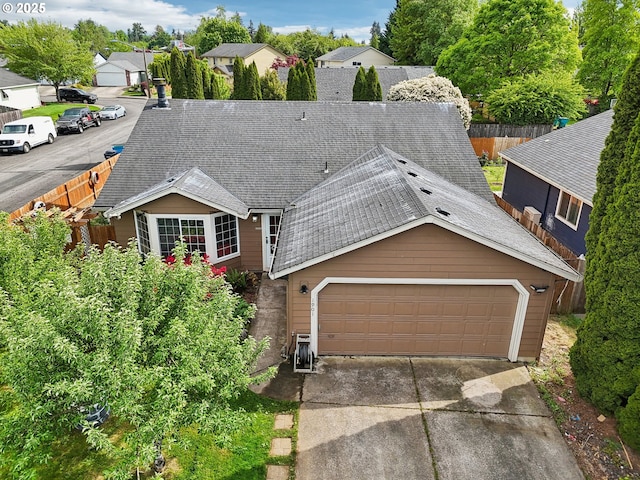 1901 NW 4th St, Battle Ground, WA 98604 - view of front of property with a shingled roof, fence, concrete driveway, a garage, and a residential view