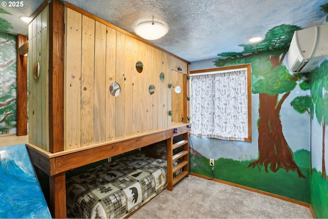 1901 NW 4th St, Battle Ground, WA 98604 - bedroom featuring a wall mounted air conditioner, a textured ceiling, carpet, and wooden walls