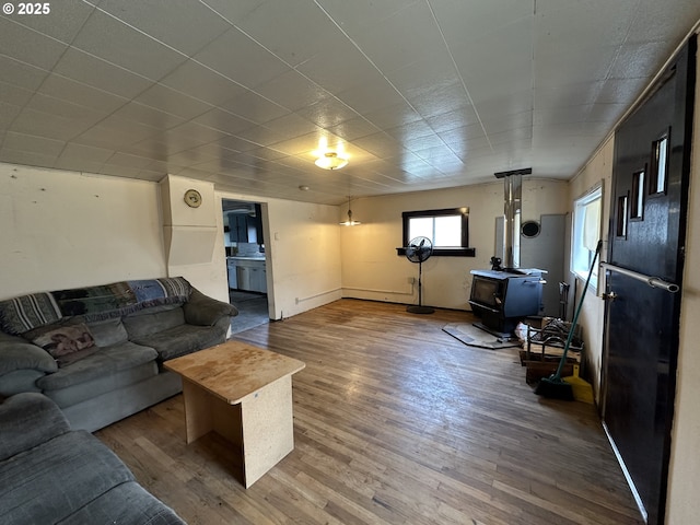 103 B Ave, Seneca, OR 97873 - living area with a wood stove and wood finished floors