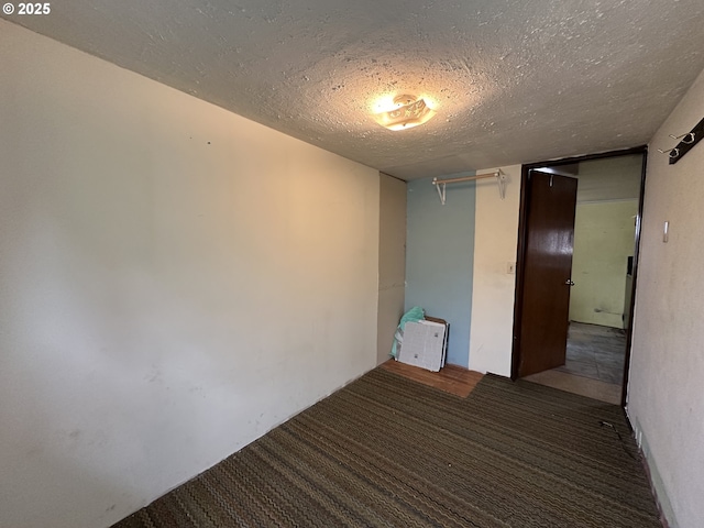 103 B Ave, Seneca, OR 97873 - empty room featuring a textured ceiling and carpet flooring