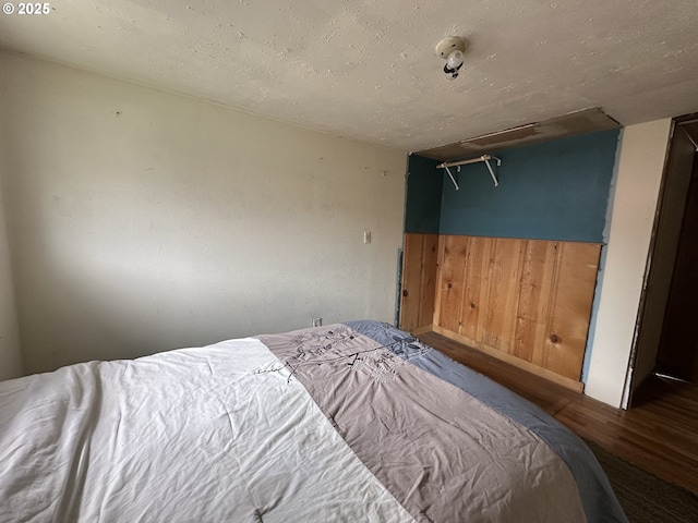 103 B Ave, Seneca, OR 97873 - bedroom featuring wood finished floors and wooden walls