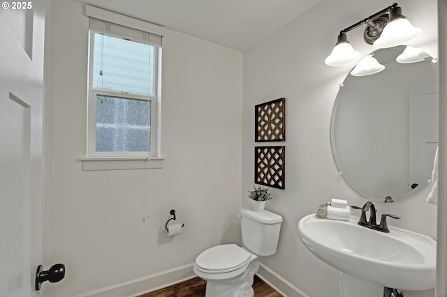 5316 SE Lone Oak St, Hillsboro, OR 97123 - half bath with baseboards, a sink, toilet, and wood finished floors