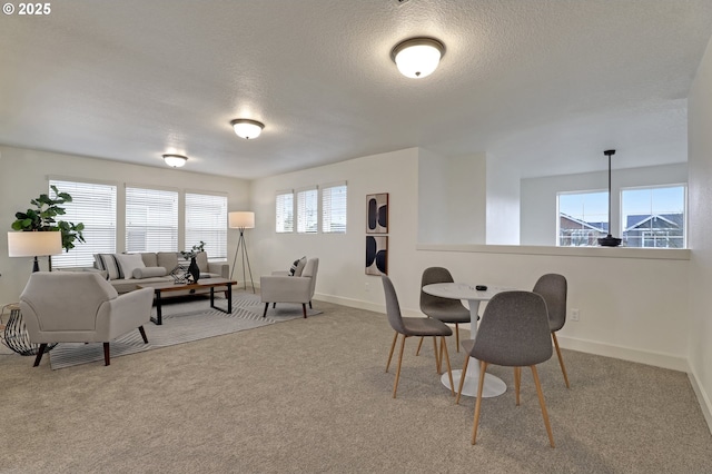5316 SE Lone Oak St, Hillsboro, OR 97123 - dining area featuring a textured ceiling, carpet flooring, and baseboards