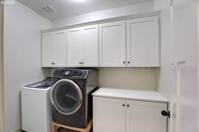 5316 SE Lone Oak St, Hillsboro, OR 97123 - clothes washing area featuring washer and dryer, visible vents, and cabinet space