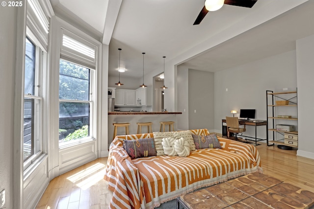 2176 NW Everett St Unit 1, Portland, OR 97210 - living room with light wood-style floors, a ceiling fan, and a desk