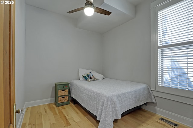 2176 NW Everett St Unit 1, Portland, OR 97210 - bedroom featuring light wood-type flooring, multiple windows, and ceiling fan