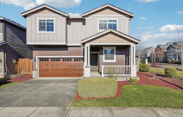 view of front of house featuring a garage and a porch