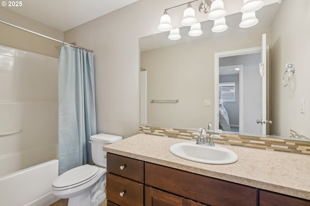 full bathroom with vanity, toilet, shower / tub combo, and backsplash