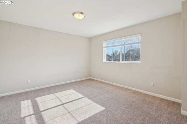 empty room featuring light colored carpet