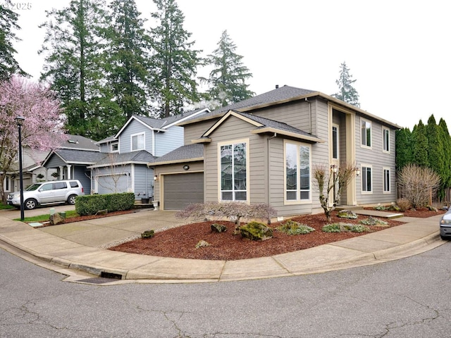 view of front of home with concrete driveway, an attached garage, and a shingled roof