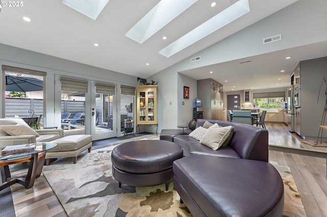 240 Greenridge Dr, Lake Oswego, OR 97035 - living room with a skylight, light wood finished floors, recessed lighting, and high vaulted ceiling