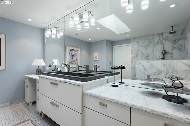 240 Greenridge Dr, Lake Oswego, OR 97035 - bathroom featuring vanity, a marble finish shower, recessed lighting, and a skylight