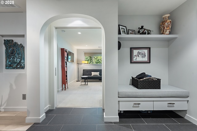 240 Greenridge Dr, Lake Oswego, OR 97035 - corridor with arched walkways, recessed lighting, dark carpet, and dark tile patterned floors
