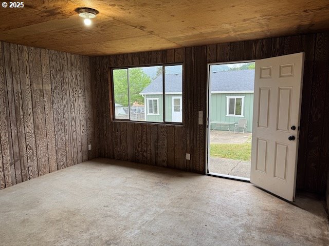 847 NE Jackson Ave, Myrtle Creek, OR 97457 - carpeted spare room featuring wooden walls and wooden ceiling