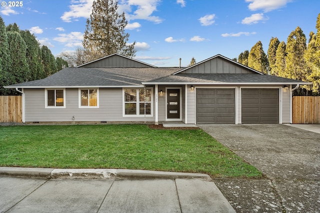 ranch-style home featuring a front lawn and a garage