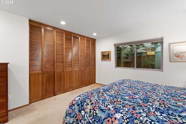 carpeted bedroom featuring a closet