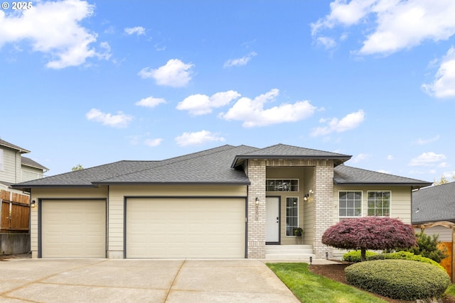 1273 SE Williams Ave, Gresham, OR 97080 - prairie-style house featuring an attached garage, a shingled roof, fence, and driveway
