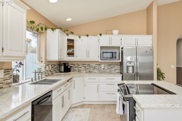 1273 SE Williams Ave, Gresham, OR 97080 - kitchen featuring backsplash, appliances with stainless steel finishes, vaulted ceiling, a sink, and recessed lighting