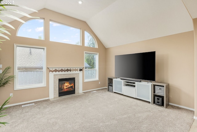 1273 SE Williams Ave, Gresham, OR 97080 - unfurnished living room with a tiled fireplace, carpet floors, baseboards, and visible vents