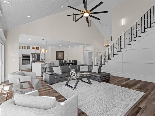 living room with wood ceiling, a chandelier, high vaulted ceiling, ornamental molding, and dark hardwood / wood-style flooring