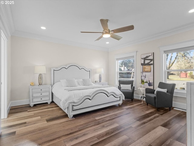 bedroom with multiple windows, crown molding, hardwood / wood-style floors, and ceiling fan