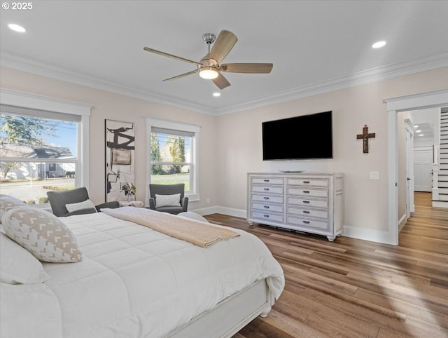 bedroom featuring crown molding, ceiling fan, and wood-type flooring