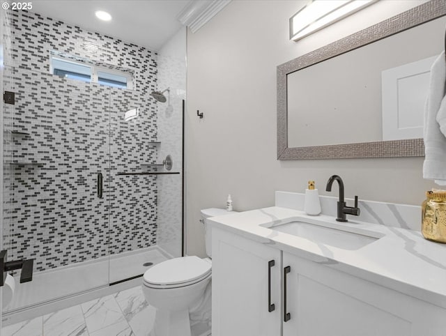 bathroom featuring walk in shower, vanity, and toilet