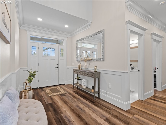 entryway featuring ornamental molding and wood-type flooring