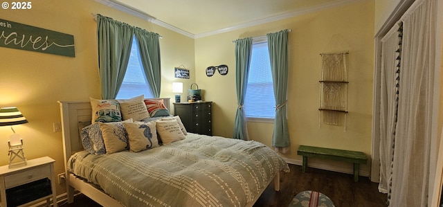 bedroom featuring crown molding and dark wood-type flooring