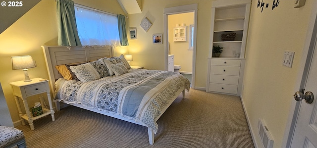 bedroom featuring carpet flooring and connected bathroom