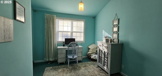 office area with vaulted ceiling