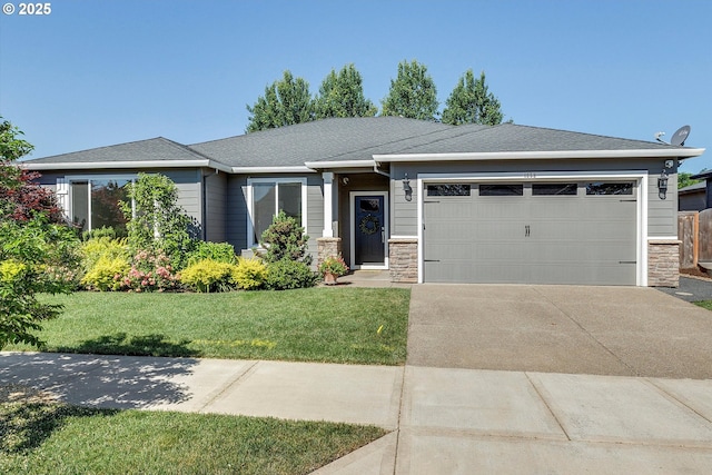 1059 S Walnut St, Canby, OR 97013 - view of front of property with an attached garage, stone siding, driveway, and a front lawn