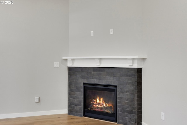 1059 S Walnut St, Canby, OR 97013 - detailed view of a fireplace, wood finished floors, and baseboards