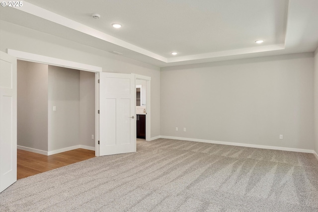 1059 S Walnut St, Canby, OR 97013 - unfurnished bedroom with a raised ceiling, light colored carpet, recessed lighting, and baseboards