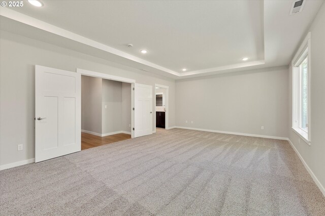1059 S Walnut St, Canby, OR 97013 - unfurnished living room featuring carpet, recessed lighting, a tray ceiling, and baseboards