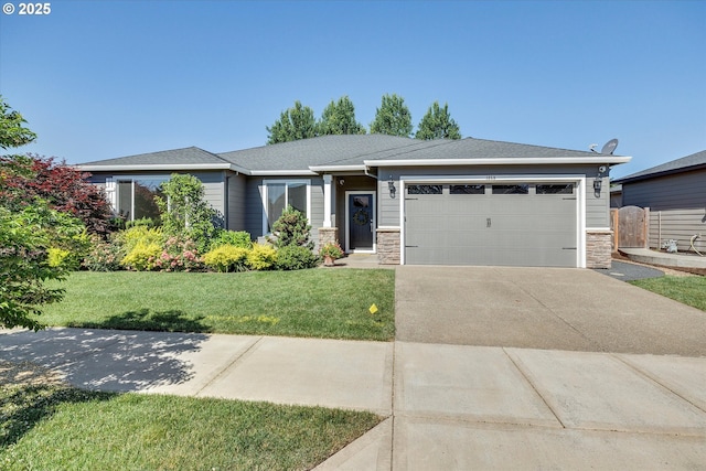 1059 S Walnut St, Canby, OR 97013 - view of front facade featuring an attached garage, driveway, stone siding, and a front yard