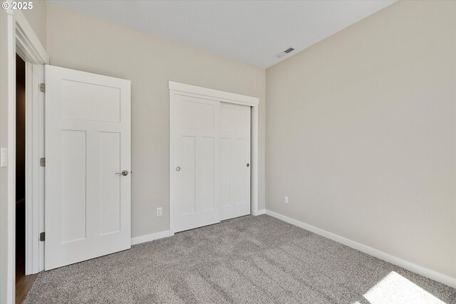 1059 S Walnut St, Canby, OR 97013 - unfurnished bedroom with carpet flooring, baseboards, and a closet