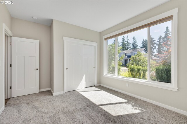 1059 S Walnut St, Canby, OR 97013 - unfurnished bedroom featuring carpet floors, baseboards, and a closet
