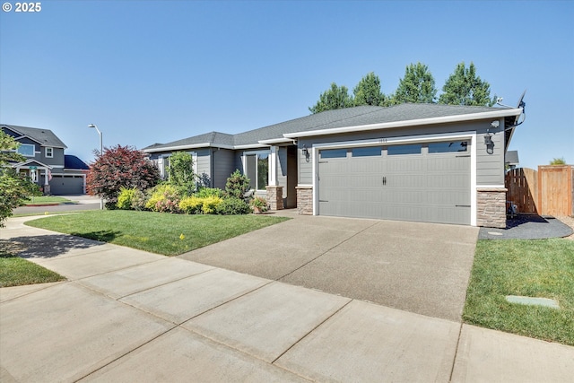 1059 S Walnut St, Canby, OR 97013 - view of front of property with stone siding, concrete driveway, and an attached garage