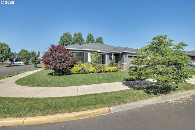 1059 S Walnut St, Canby, OR 97013 - view of front of house with an attached garage, a front yard, and roof with shingles