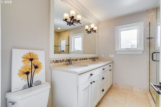 bathroom with backsplash, tile patterned flooring, vanity, walk in shower, and toilet